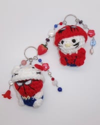 Image 1 of hello kitty x spider-man keychains