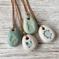 Image 3 of Handmade Ceramic Pebble Pendant – Wearable Essential Oil Diffuser