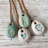 Image 2 of Handmade Ceramic Pebble Pendant – Wearable Essential Oil Diffuser