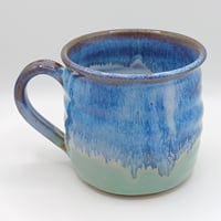 Image 1 of Chunky rippled mug. Blue on Green