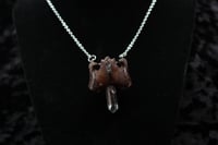 Image 2 of Dead good vertebrae and quartz piece