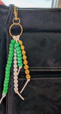 Image 2 of St. Patrick's Day green, white and gold beaded purse charm keychain 