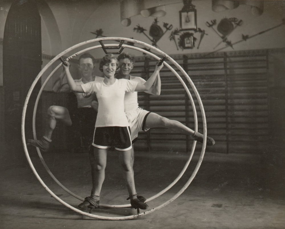 Image of Anonyme: Interwar gymnasts posing in a Rhönrad, Germany ca. 1929