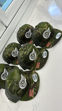 Camo snap backs