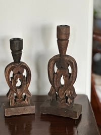 Set of two carved wooden candle holder