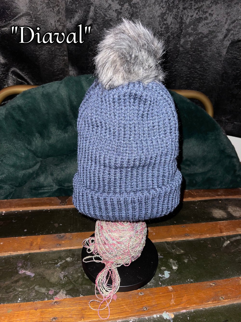 Image of Knitted Beanie With Puff Ball