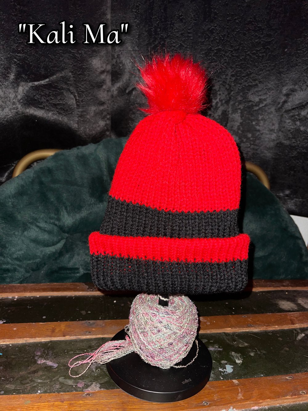 Image of Knitted Beanie With Puff Ball