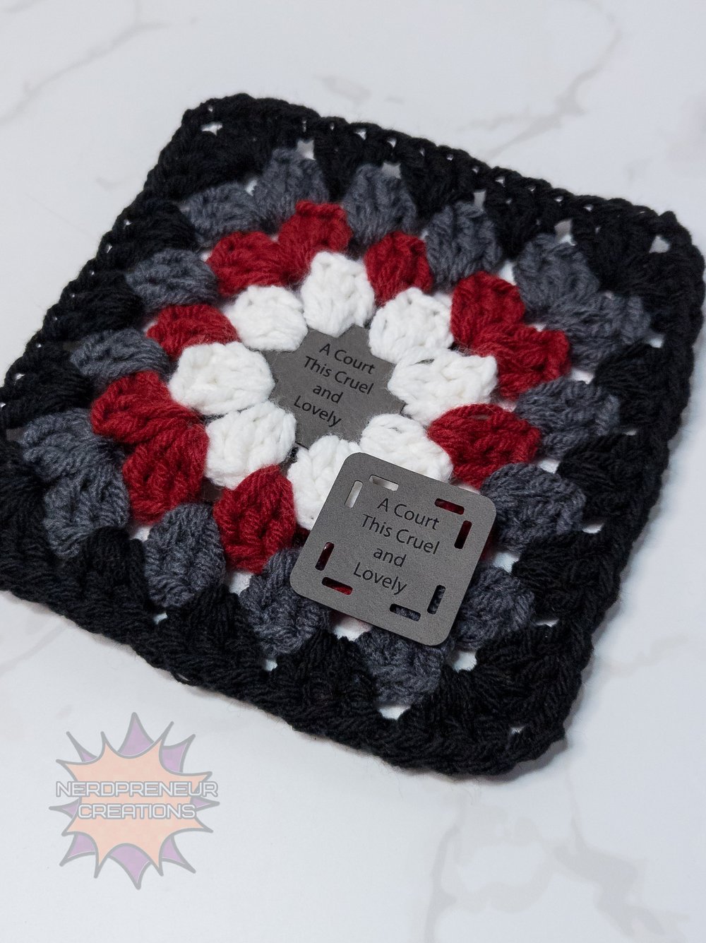Image of Bookish Granny Starter Tags β Small Faux Leather Granny Square Patch for Book-Themed Crochet