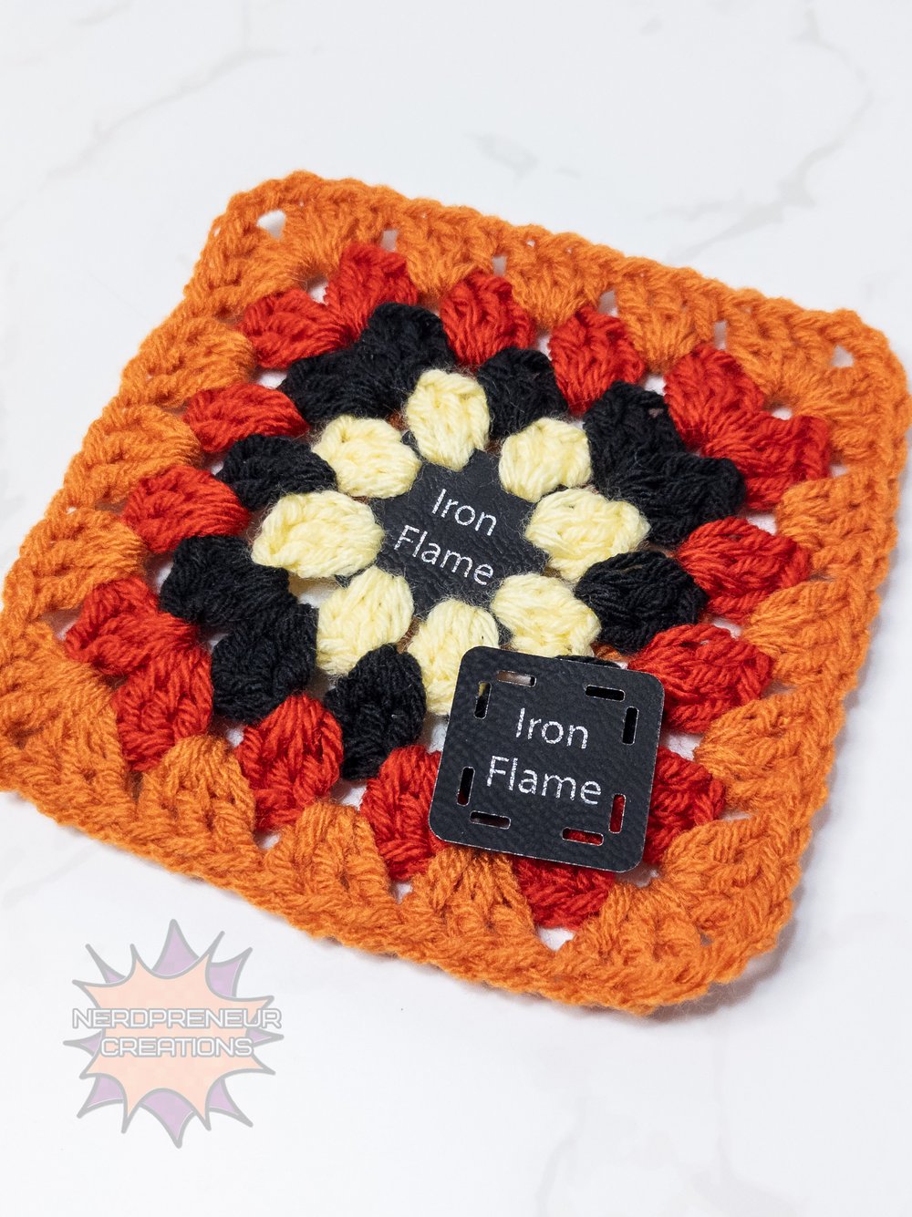 Image of Bookish Granny Starter Tags β Small Faux Leather Granny Square Patch for Book-Themed Crochet