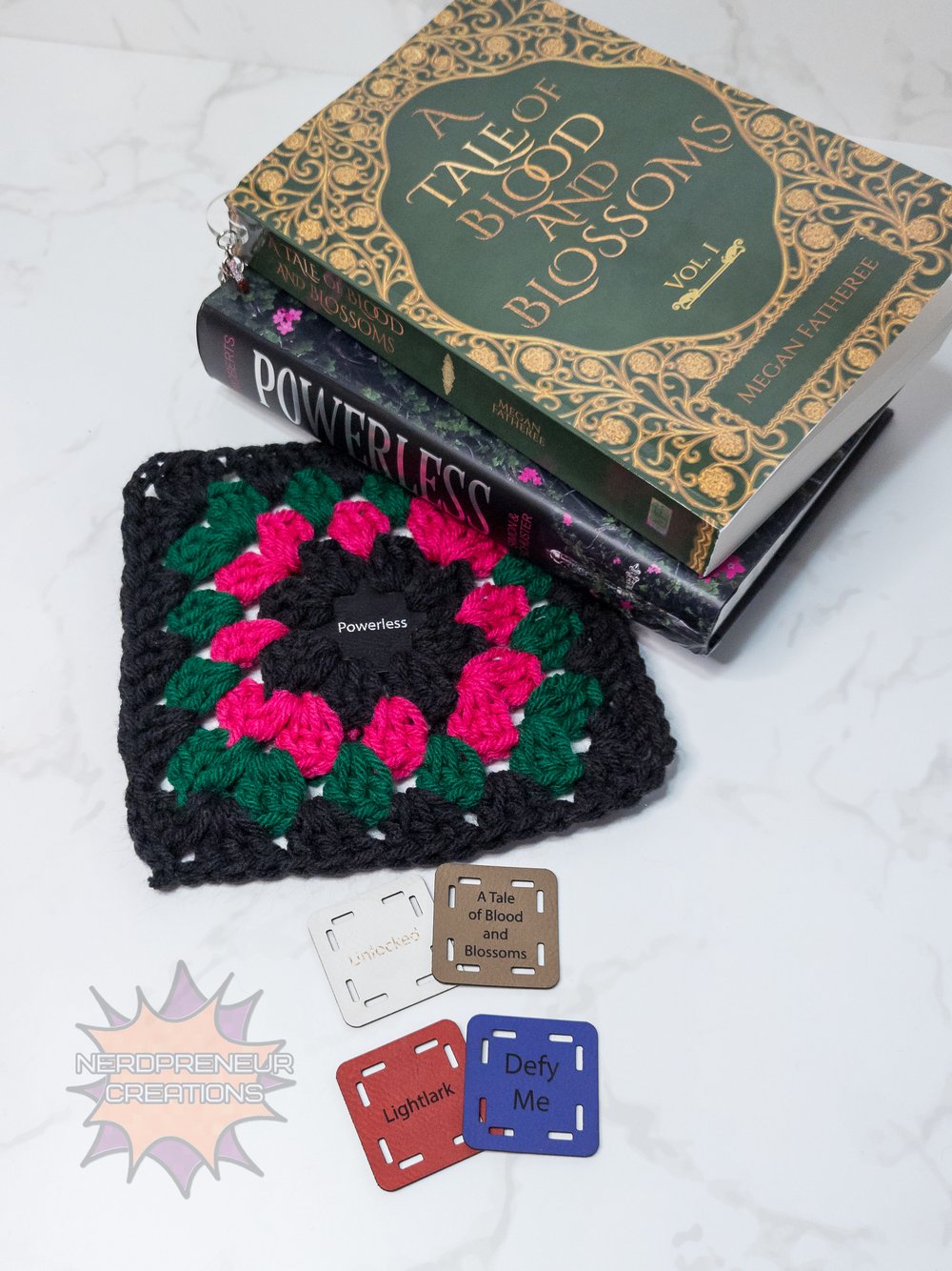 Image of Bookish Granny Starter Tags β Small Faux Leather Granny Square Patch for Book-Themed Crochet