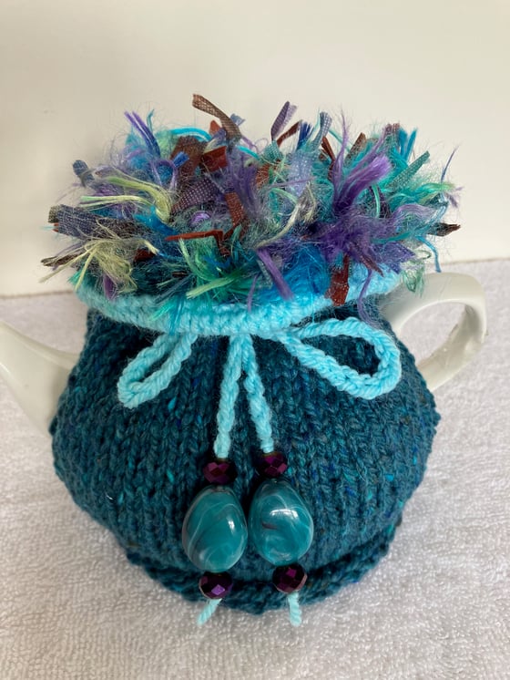 Image of small TURQUOISE Go On! tea cosie