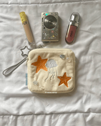 Image 1 of on the shore plush pouch