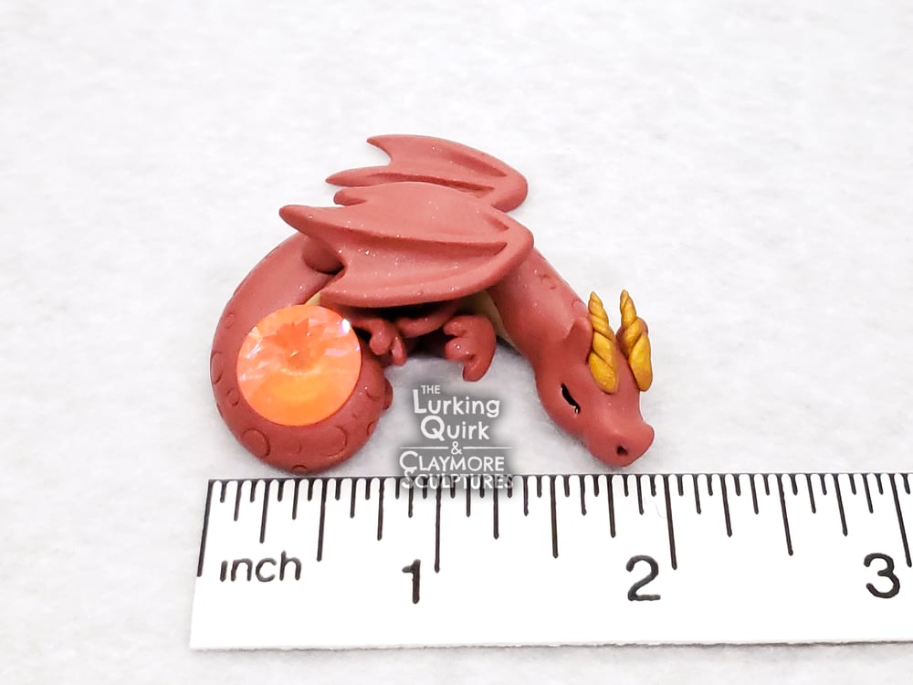Small Red Sleeping Dragon with Orange Crystal