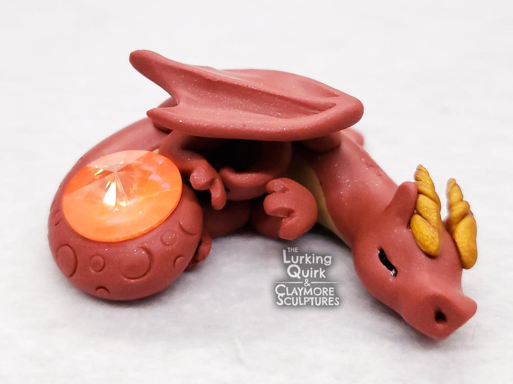 Small Red Sleeping Dragon with Orange Crystal