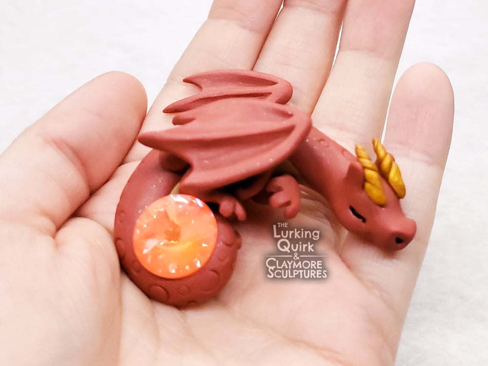 Small Red Sleeping Dragon with Orange Crystal