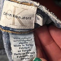 Image 6 of Women's Calvin Klein Vintage flare bottom jeans criss cross suede ties on sides knee to hem