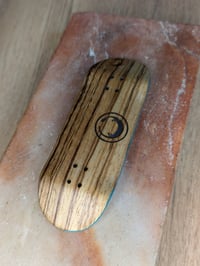 Image 1 of Mini logo (zebra wood) - G4.1 34mm