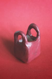 Image 1 of clay baggu