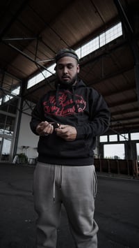 Image 1 of Apply Pressure, Stay Humble Hoodie (Black/Red)