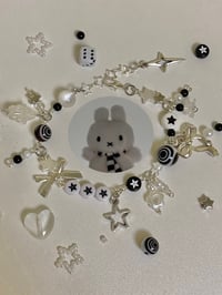Image 1 of black and white cluttered bracelet