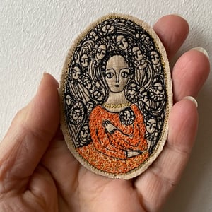 Image of Embroidery portrait brooch - woman in orange