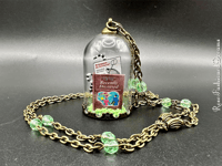 Image 6 of Uranium Handbook For The Recently Deceased Glass Dome Neckalce With Wooden Hanger