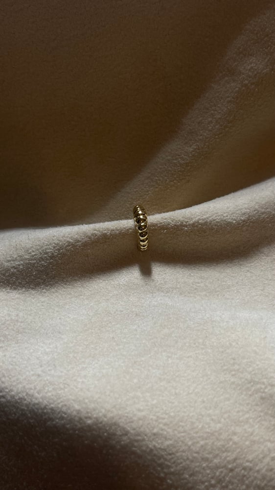 Image of The thin croissant faux nose ring 