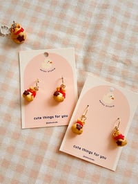 Image 1 of Animal Frosting Money Bag Dangle Earrings