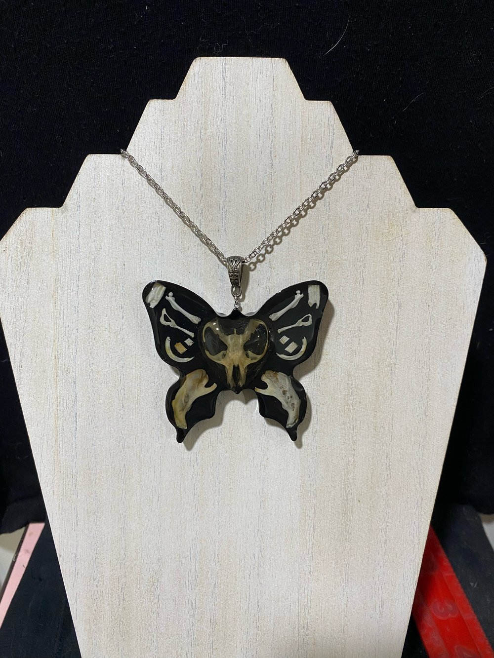 Butterfly skull pendant