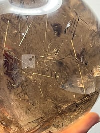 Image 16 of Golden Rutile In Smoky Quartz Sphere #1770