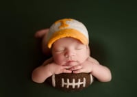 Newborn prop football 