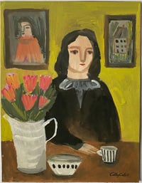 Woman at a table in a yellow room 
