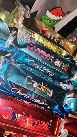 Image of Foil card crackers full of sweets