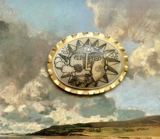 LARGE SUN WITH PIPE BROOCH