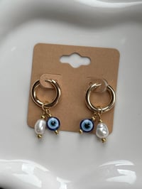 Image 2 of 18k gold Evil Eye Pearl Huggies