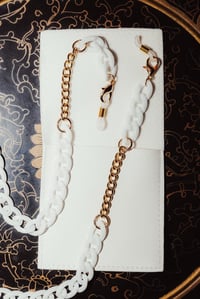 Image 1 of white and gold eyeglass chain