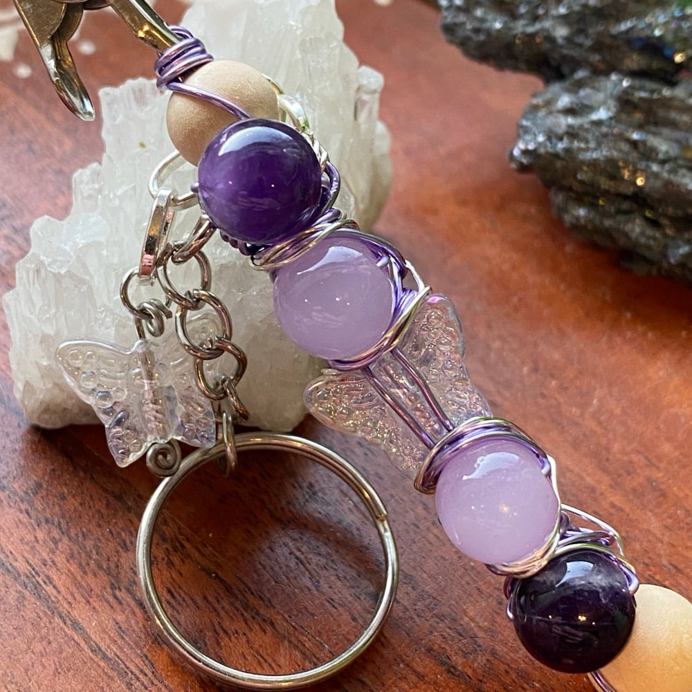 Image of iris wing clip keychain 