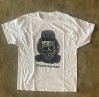 Image 1 of Jerry wearing a P hat shirt