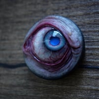 Image 3 of Custom Swappable Phone Grip for smartphones, bright blue reflective pupil, glow in the dark 