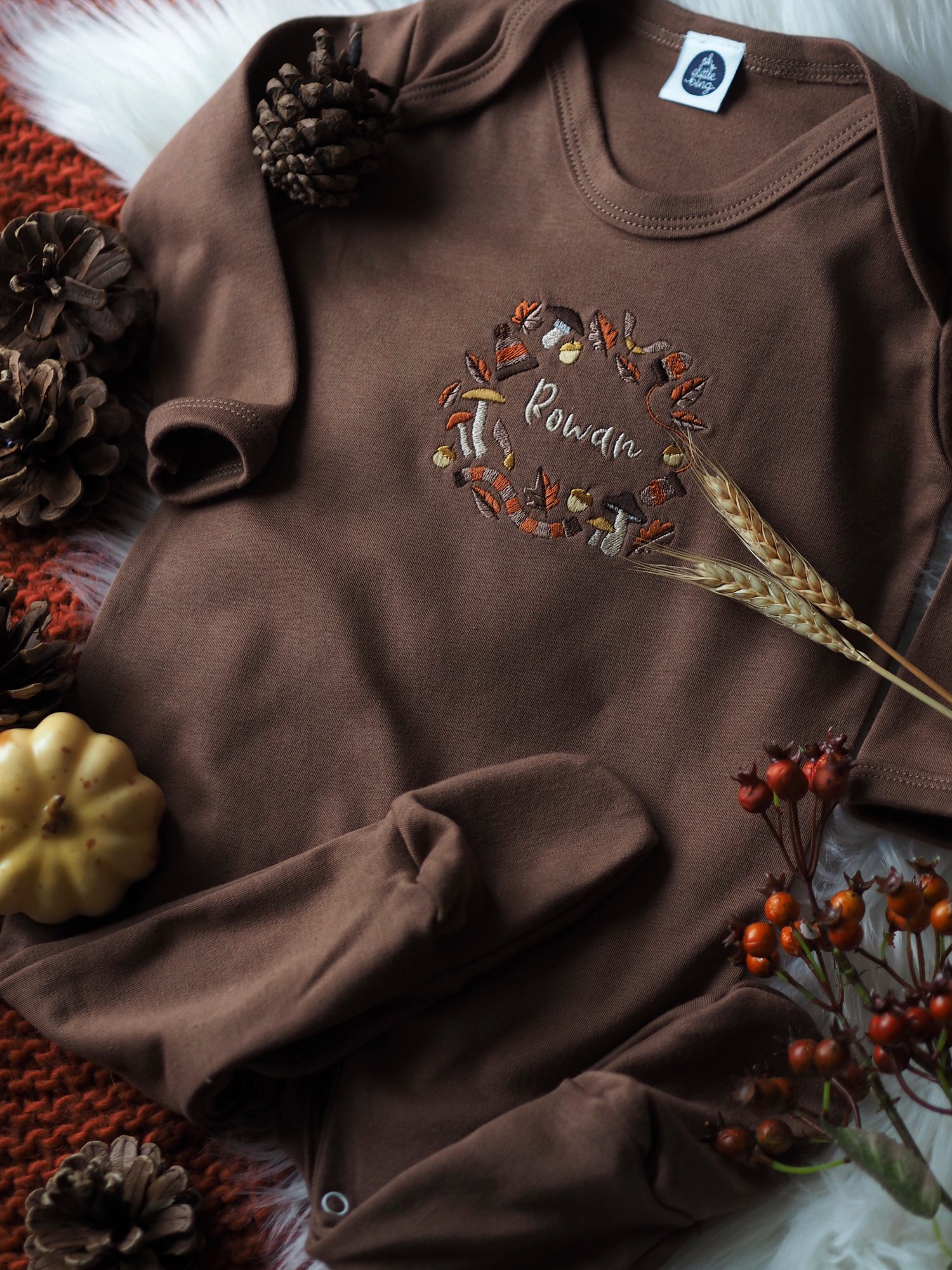 Image of A Rustling Stroll - Cinnamon sleepsuit