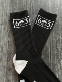 Image 1 of 603 black/white socks with NH on the bottom