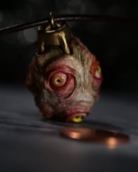 Image 18 of Egg of the King pendant, leather cord, brass hardware, all seeing glowing eyes
