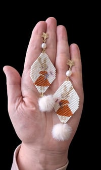 Image 1 of Bunny girl with flower