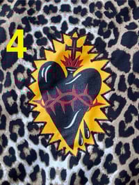 Image 11 of new dark leopard sacred heart appliqué  star bag