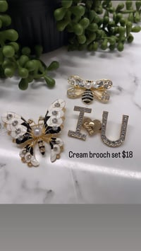Cream brooch set