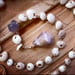 Image of Dainty Hawaiian puka shell wrap bracelet or necklace with a purple cone shell