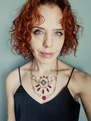 Red necklace with ethnic element 