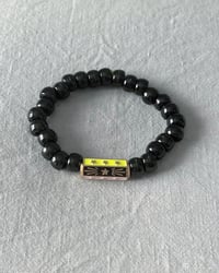 Bracelet noir et jaune 