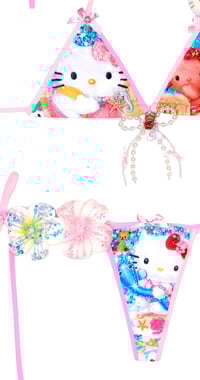 Image 4 of tanned hellokitty in the beach ball game