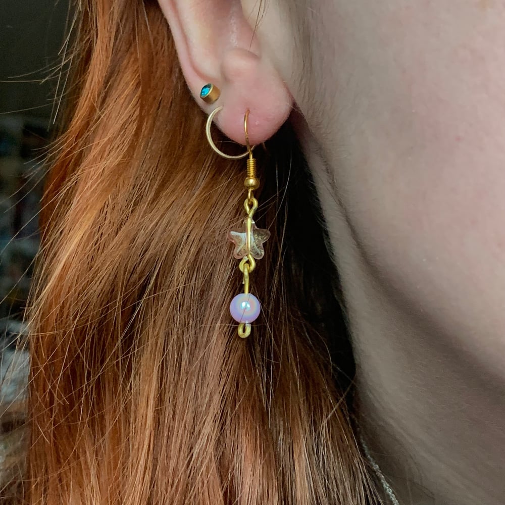 Image of pink star earrings